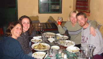 Shayna Peavey and Ross Wolman sit with their moms in cafe Acha